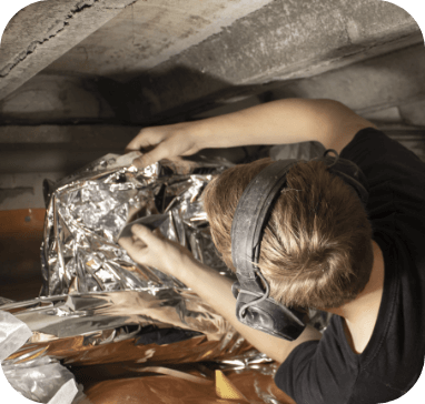 Person wrapping something in foil